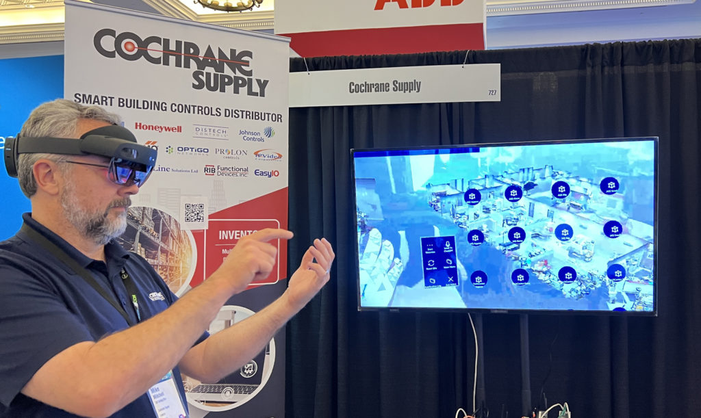 cochrane supply CTO mike mitchell demonstrates augmented reality technology for BAS as realcomm IBcon 2023